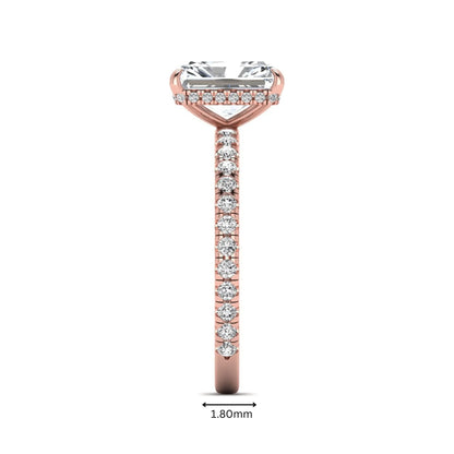 Radiant cut lab grown diamond hidden halo engagement ring featuring a four prong setting, pavé round diamonds, and rose gold tone design.