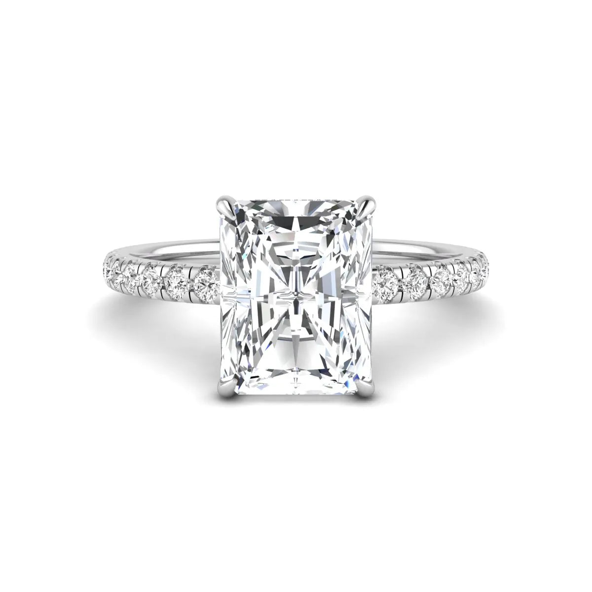 Radiant cut lab grown diamond hidden halo engagement ring featuring a four prong setting, pavé round diamonds, and white gold tone design.