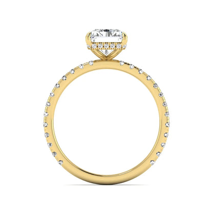 Radiant cut lab grown diamond hidden halo engagement ring featuring a four prong setting, pavé round diamonds, and yellow gold tone design.