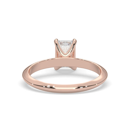 Rose-gold ring with a diamond on a white background
