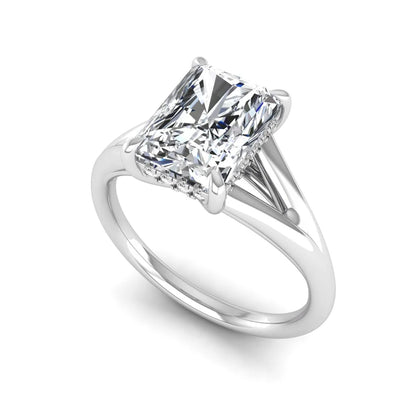 IGI Certified 1.74 carat radiant cut lab grown diamond hidden halo engagement ring with round accent diamonds in white gold.