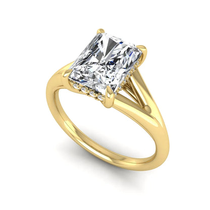 IGI Certified 1.74 carat radiant cut lab grown diamond hidden halo engagement ring with round accent diamonds in yellow gold.