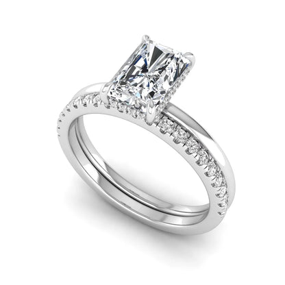Radiant cut lab grown diamond hidden halo engagement ring with pavé matching wedding band in a white gold setting