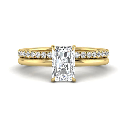 Radiant cut lab grown diamond hidden halo engagement ring with pavé matching wedding band in a yellow gold setting