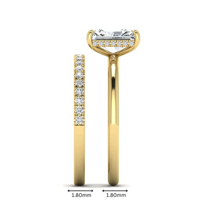 Radiant cut lab grown diamond hidden halo engagement ring with pavé matching wedding band in a yellow gold setting