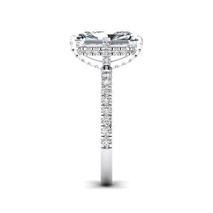 white-gold Diamond ring with a central emerald-cut stone and smaller diamonds on a white background