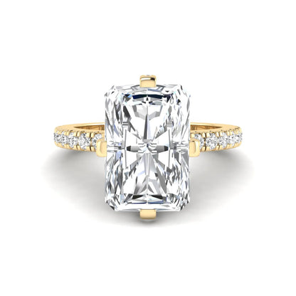 yellow-gold Gold ring with a large rectangular diamond and smaller diamonds on the sides against a white background