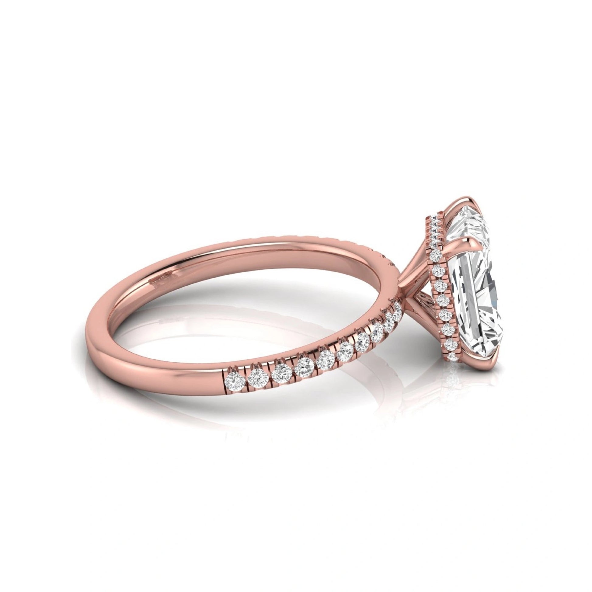 Radiant cut lab grown diamond engagement ring with hidden halo, pavé side diamonds, and four-prong setting in rose gold style.