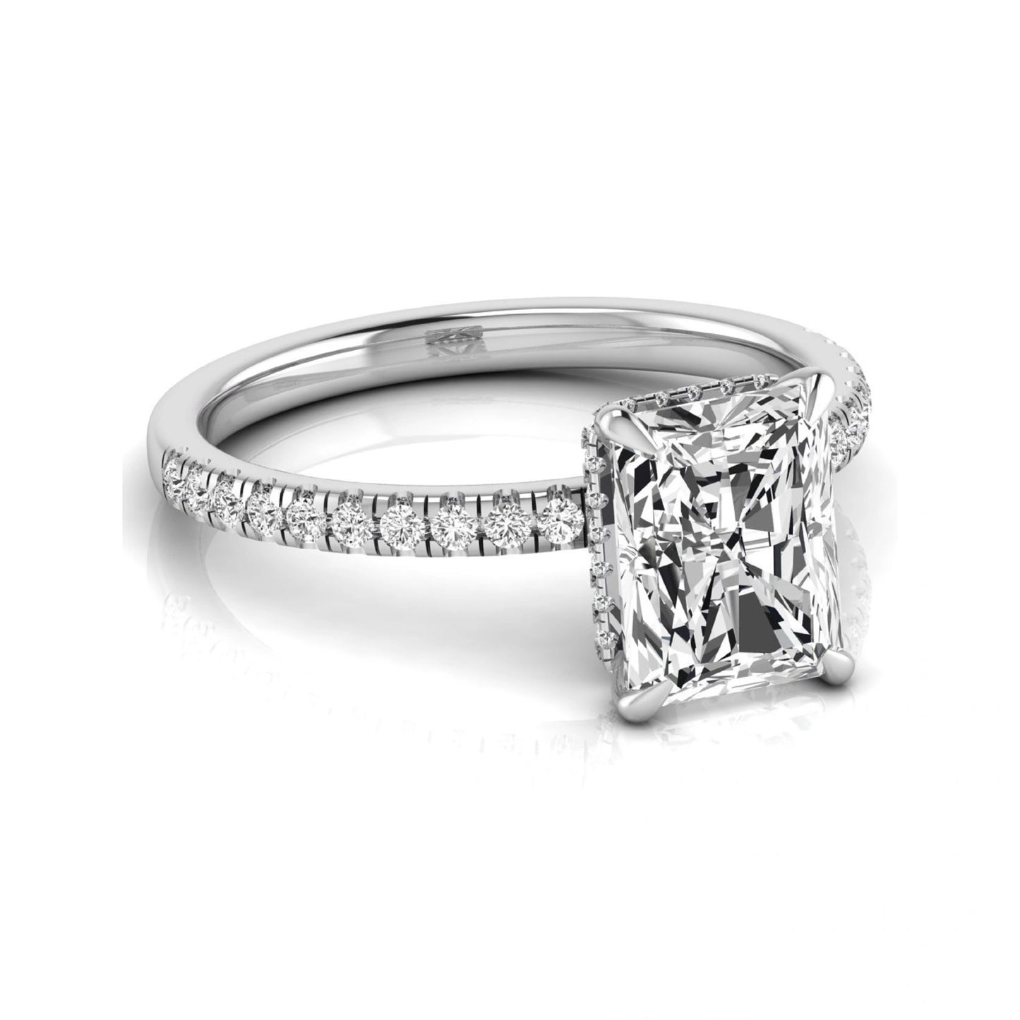 Radiant cut lab grown diamond engagement ring with hidden halo, pavé side diamonds, and four-prong setting in white gold style.