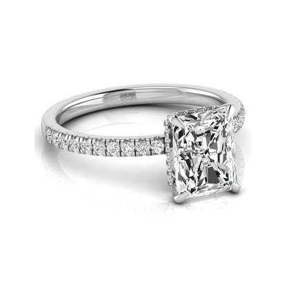 Radiant cut lab grown diamond engagement ring with hidden halo, pavé side diamonds, and four-prong setting in white gold style.