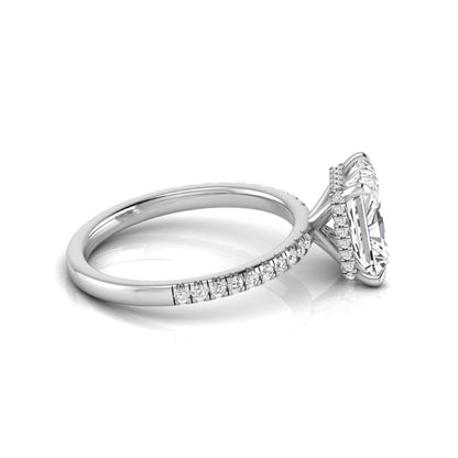 Radiant cut lab grown diamond engagement ring with hidden halo, pavé side diamonds, and four-prong setting in white gold style.