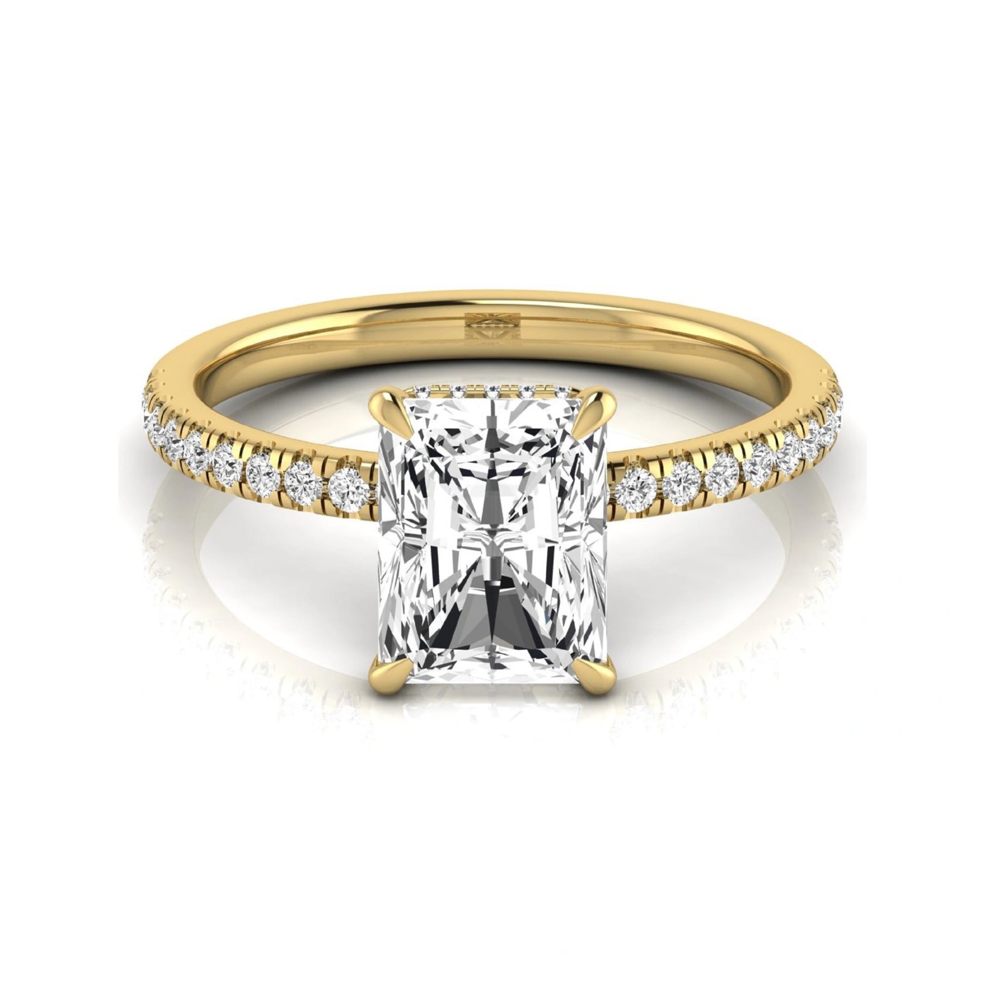 Radiant cut lab grown diamond engagement ring with hidden halo, pavé side diamonds, and four-prong setting in yellow gold style.