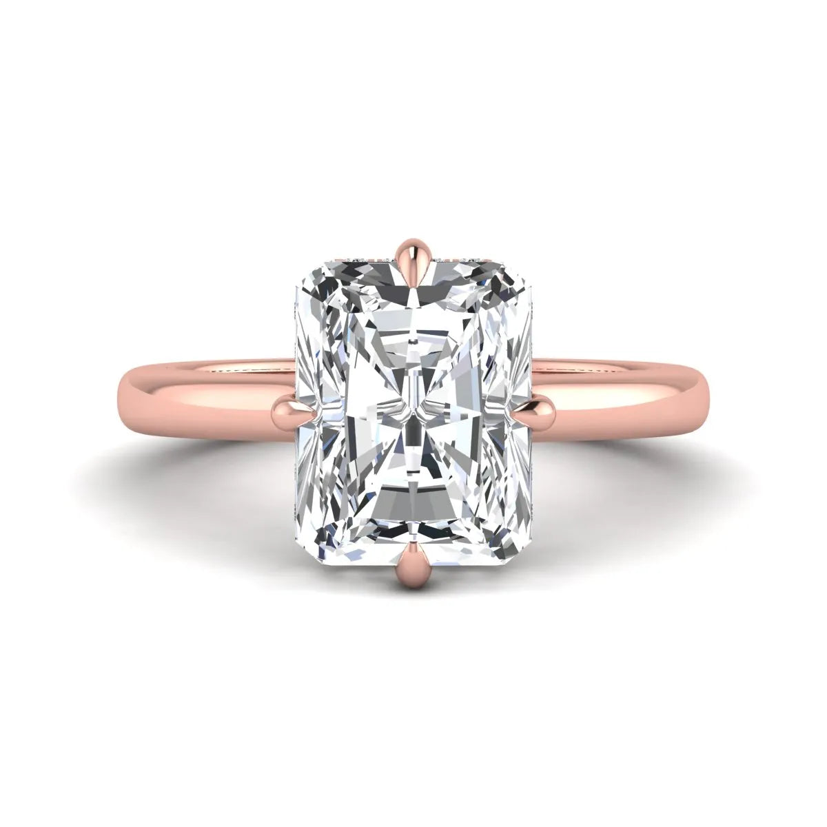 Radiant cut lab grown diamond hidden halo solitaire engagement ring with a four-prong setting and polished rose gold band.