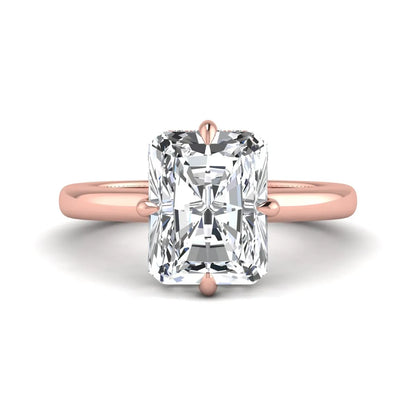 Radiant cut lab grown diamond hidden halo solitaire engagement ring with a four-prong setting and polished rose gold band.