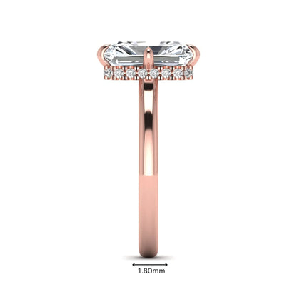 Radiant cut lab grown diamond hidden halo solitaire engagement ring with a four-prong setting and polished rose gold band.