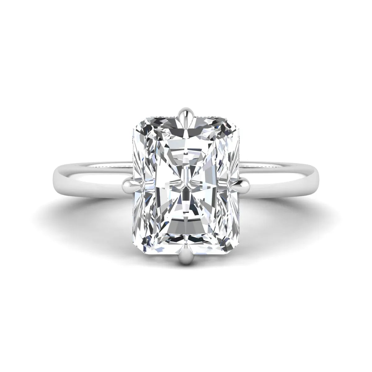 Radiant cut lab grown diamond hidden halo solitaire engagement ring with a four-prong setting and polished white gold band.