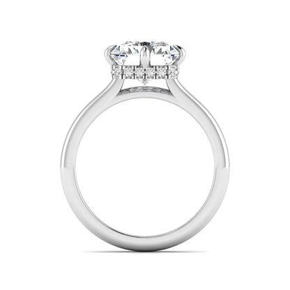 Radiant cut lab grown diamond hidden halo solitaire engagement ring with a four-prong setting and polished white gold band.