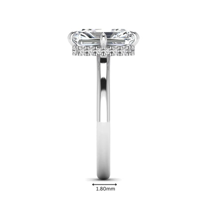 Radiant cut lab grown diamond hidden halo solitaire engagement ring with a four-prong setting and polished white gold band.