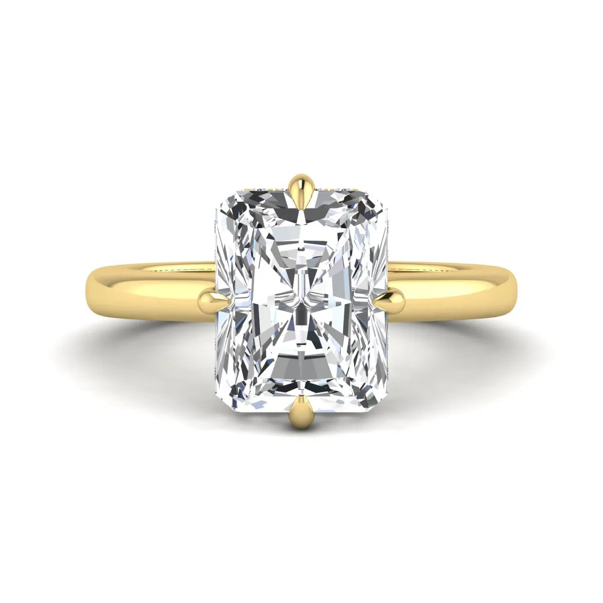 Radiant cut lab grown diamond hidden halo solitaire engagement ring with a four-prong setting and polished yellow gold band.