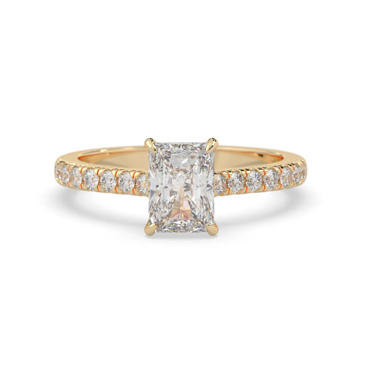 radiant cut lab grown diamond prong set engagement ring with pavé band and yellow gold metal tone design