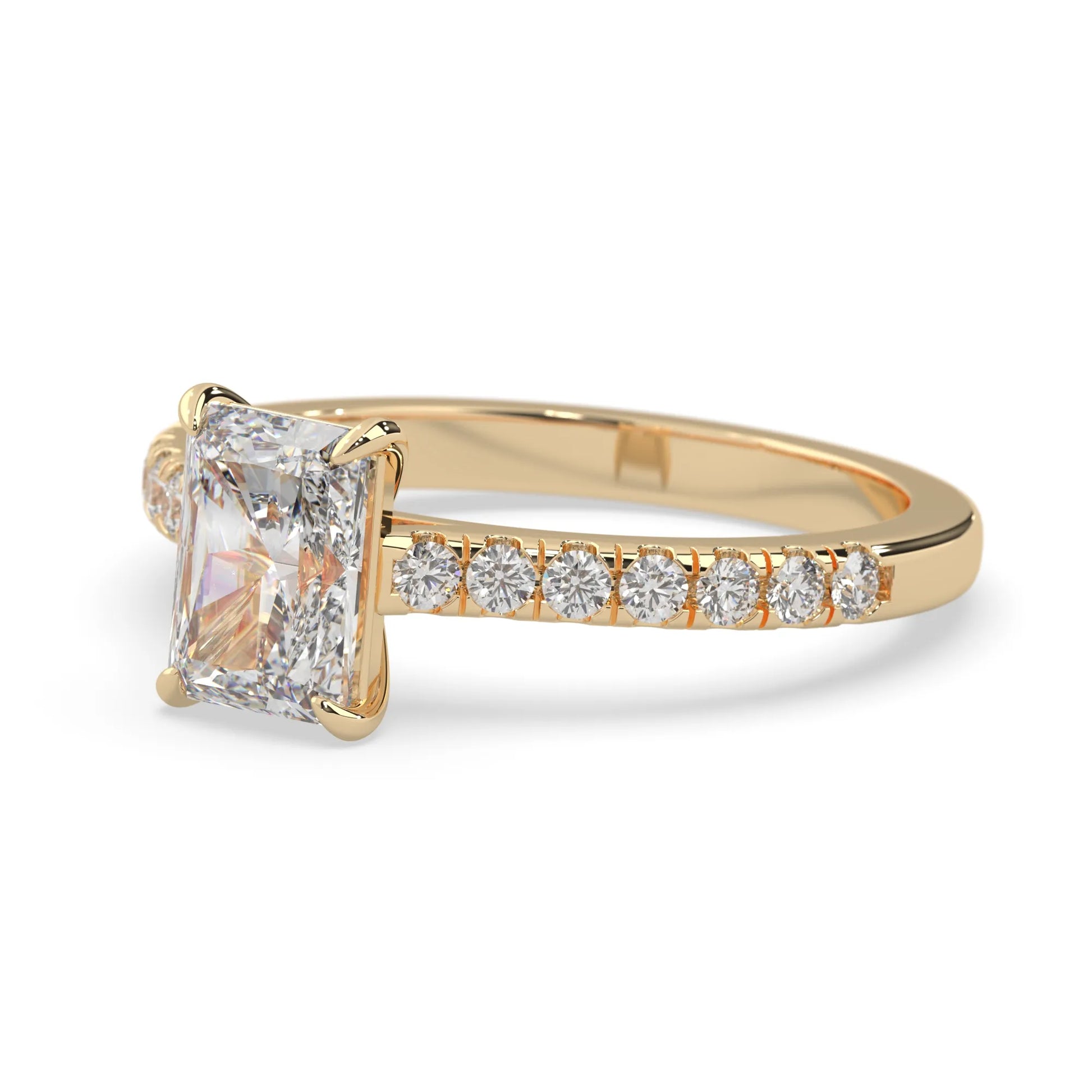 radiant cut lab grown diamond prong set engagement ring with pavé band and yellow gold metal tone design