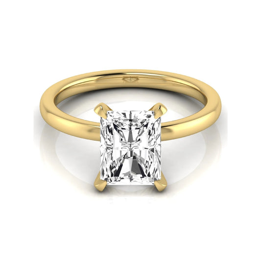 Radiant cut lab grown diamond engagement ring featuring a 2.62 carat center diamond in a classic four-prong solitaire setting with a polished yellow gold tone band.