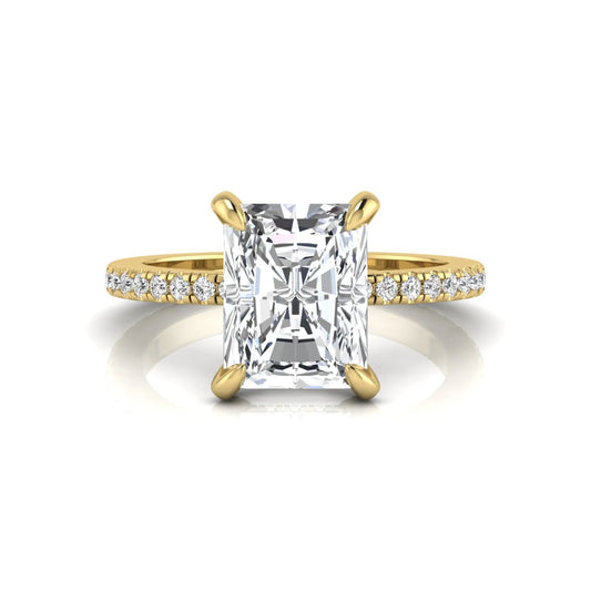 Radiant cut lab grown diamond solitaire engagement ring with hidden halo, pavé band, and yellow gold metal tone.