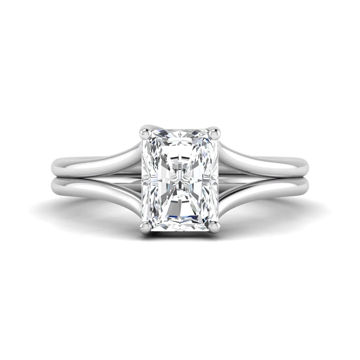 Radiant cut lab grown diamond solitaire engagement ring featuring a split shank band with a four-prong setting in polished white gold.