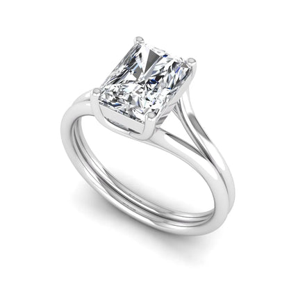 Radiant cut lab grown diamond solitaire engagement ring featuring a split shank band with a four-prong setting in polished white gold.