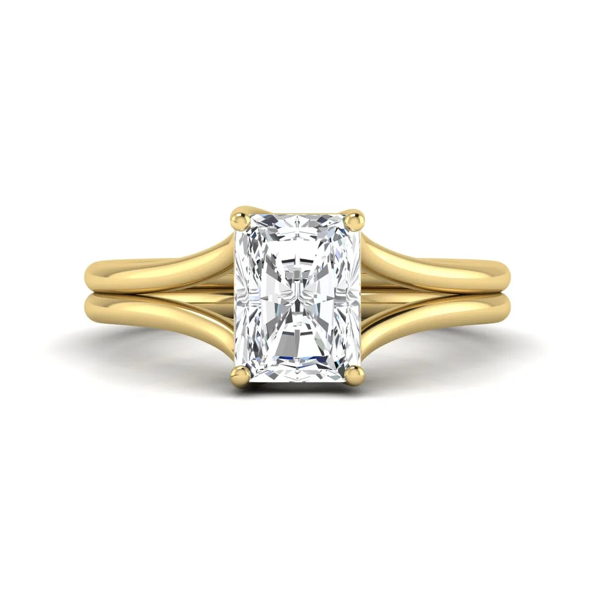 Radiant cut lab grown diamond solitaire engagement ring featuring a split shank band with a four-prong setting in polished yellow gold.