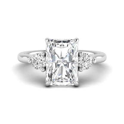 Radiant cut lab grown diamond three stone engagement ring with round side diamonds in a four-prong setting and white gold tone band.