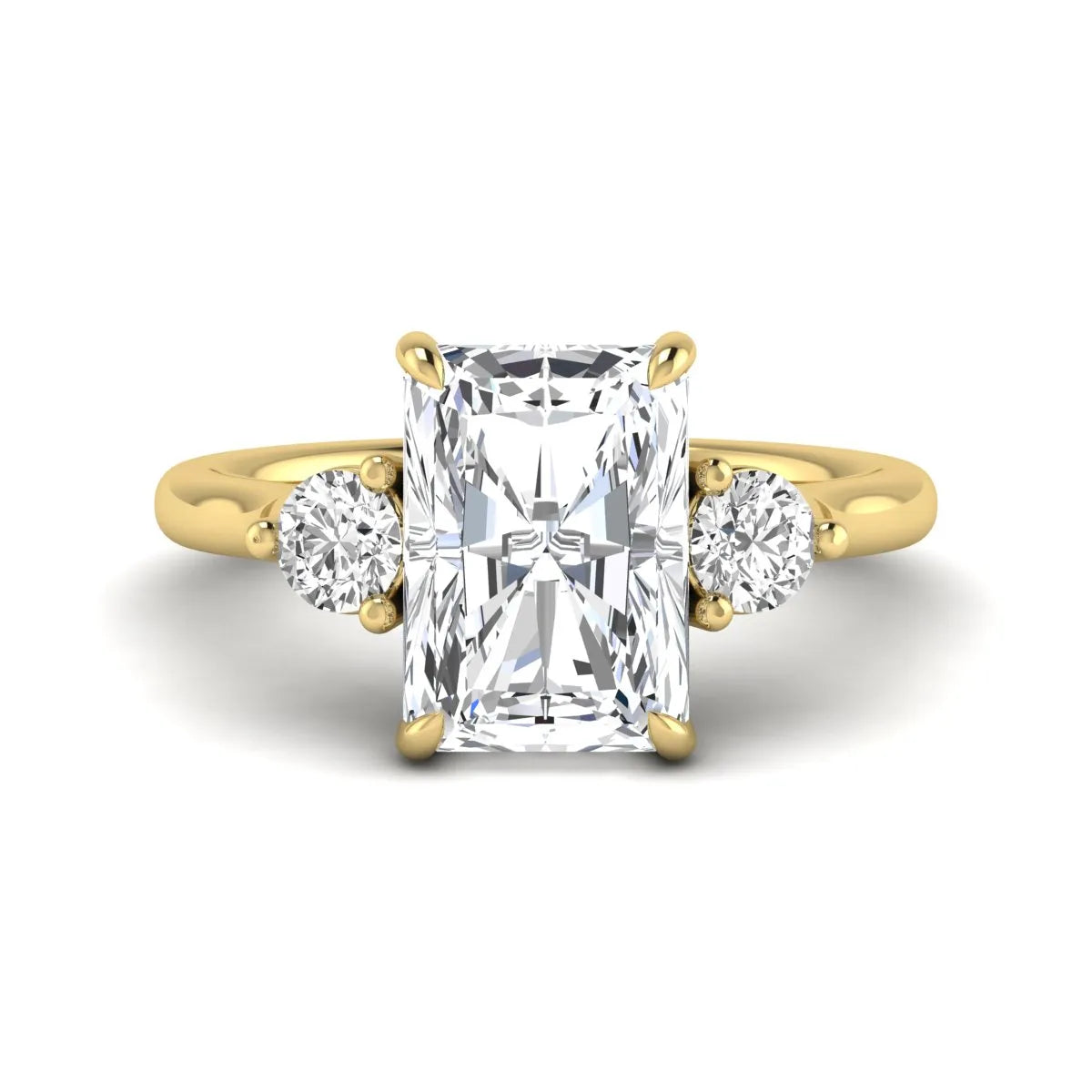 Radiant cut lab grown diamond three stone engagement ring with round side diamonds in a four-prong setting and yellow gold tone band.