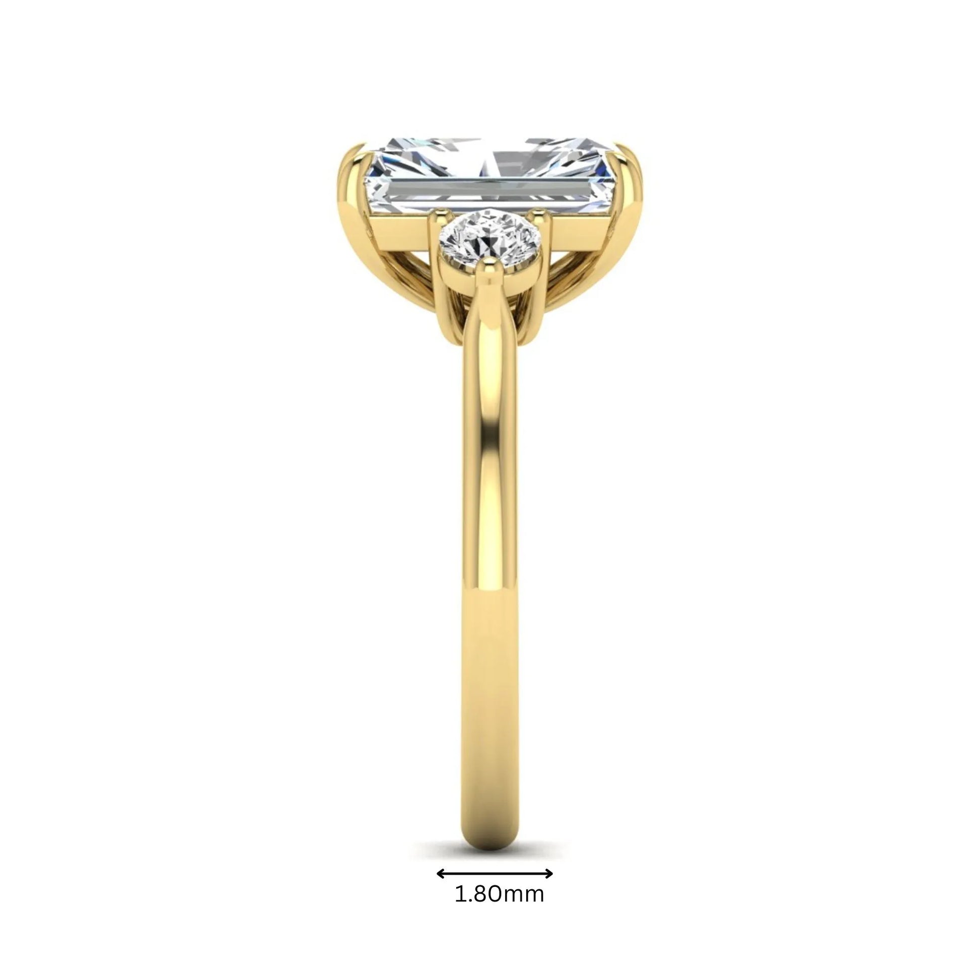 Radiant cut lab grown diamond three stone engagement ring with round side diamonds in a four-prong setting and yellow gold tone band.