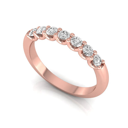 Rose-gold ring with diamonds on a white background