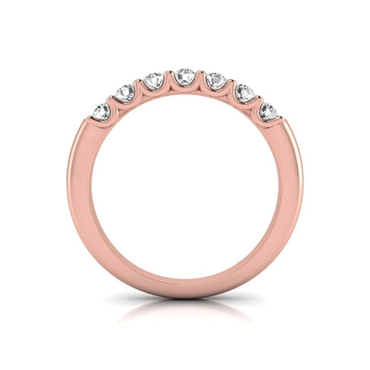Rose-gold ring with small diamonds on a white background
