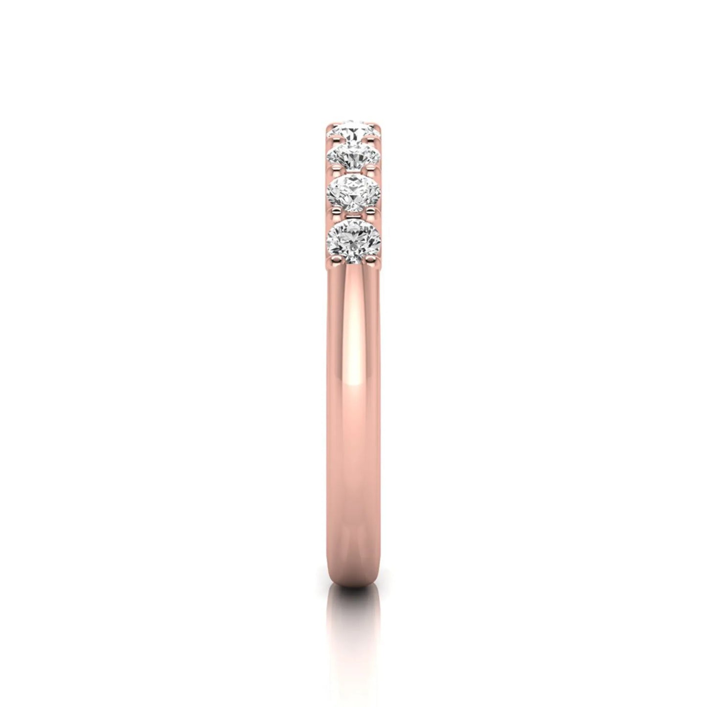 Rose-gold ring with three diamonds on a white background