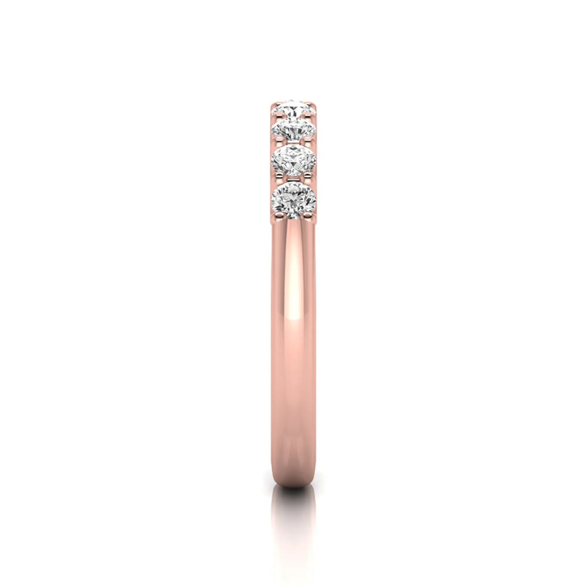 Rose-gold ring with three diamonds on a white background