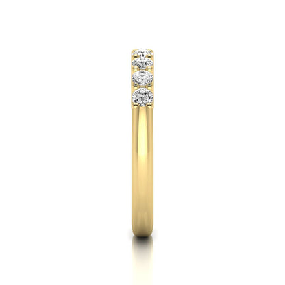 yellow-Gold ring with three diamonds on a white background