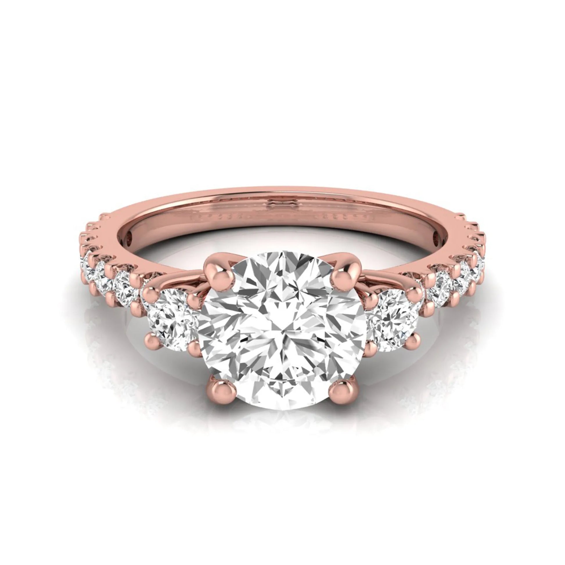 Round Accent Lab Grown Diamond Engagement Ring featuring a 7.5 mm round center diamond with round accent diamonds in a classic prong setting in rose gold