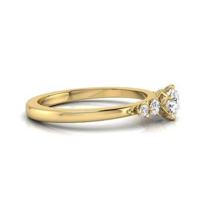 yellow gold Round cut lab grown diamond engagement ring with round accent diamonds in a classic prong setting