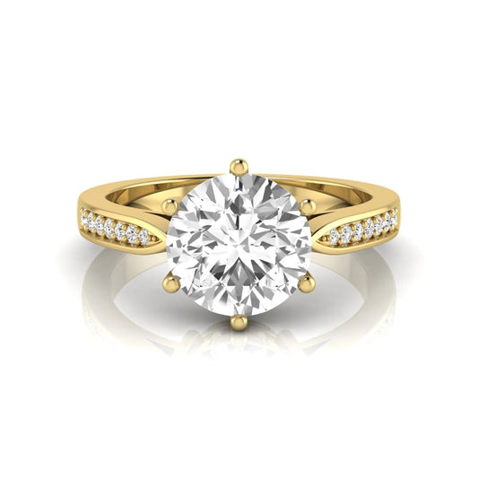Round cut lab grown diamond engagement ring featuring a six-prong setting with round accent diamonds on a tapered yellow gold style band.