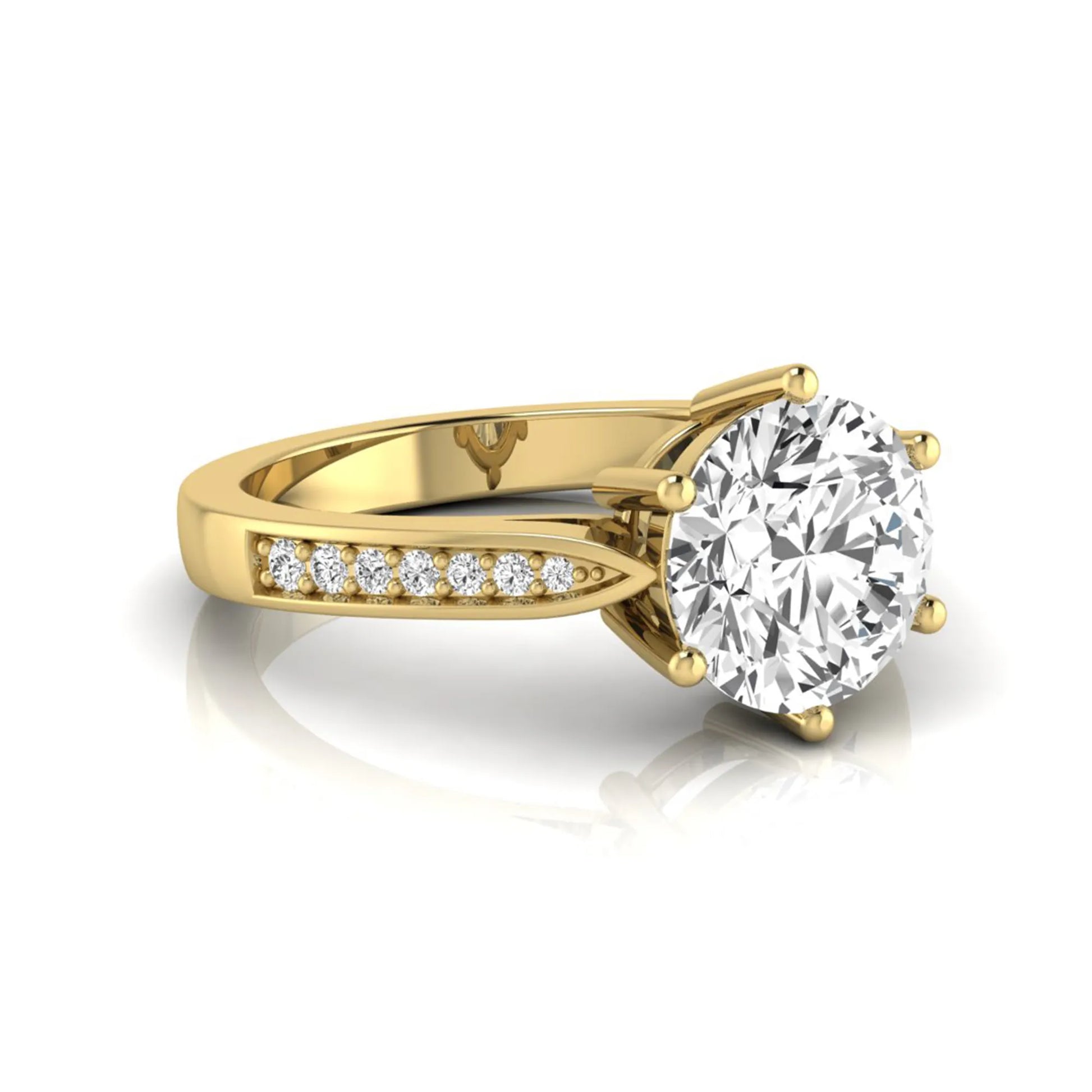 Round cut lab grown diamond engagement ring featuring a six-prong setting with round accent diamonds on a tapered yellow gold style band.
