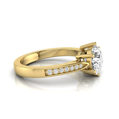 Round cut lab grown diamond engagement ring featuring a six-prong setting with round accent diamonds on a tapered yellow gold style band.