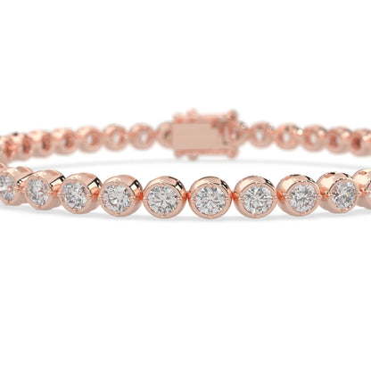 rose gold Round brilliant lab grown diamond tennis bracelet with bezel settings and a secure box clasp with double safety latch.