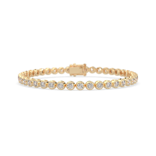 yellow gold Round brilliant lab grown diamond tennis bracelet with bezel settings and a secure box clasp with double safety latch.