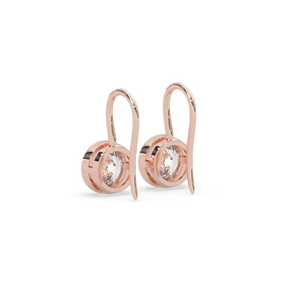 rose gold Round bezel set lab grown diamond drop earrings with 6.50 mm IGI certified round diamonds and elegant French wire hook closure.