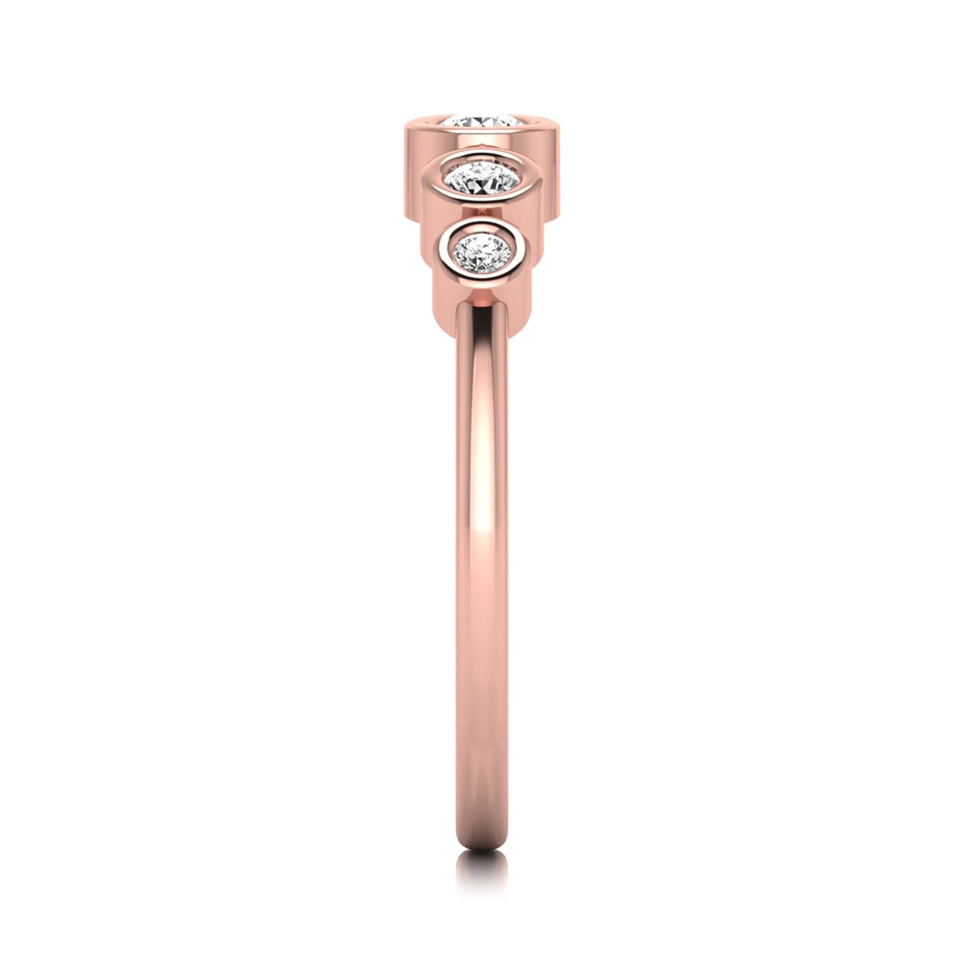 Round bezel set lab grown diamond five stone ring featuring round cut diamonds in a modern graduated design with rose gold finish.