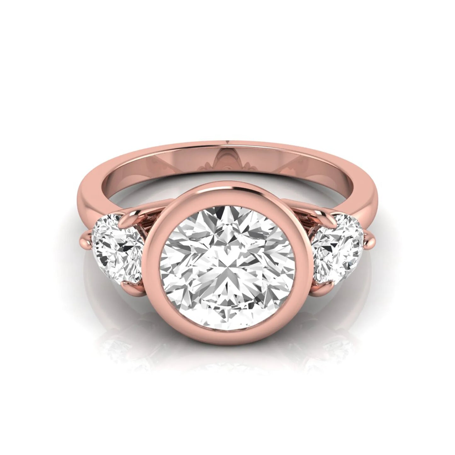 Round cut lab grown diamond three stone engagement ring with a bezel set center diamond and round side diamonds in rose gold