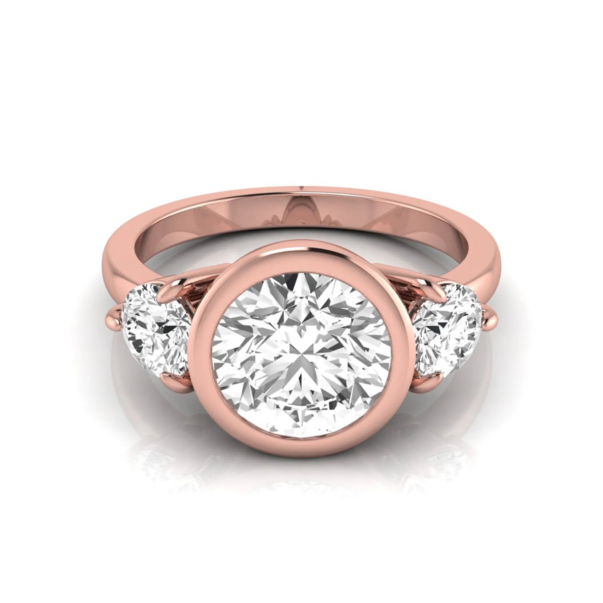Round cut lab grown diamond three stone engagement ring with a bezel set center diamond and round side diamonds in rose gold