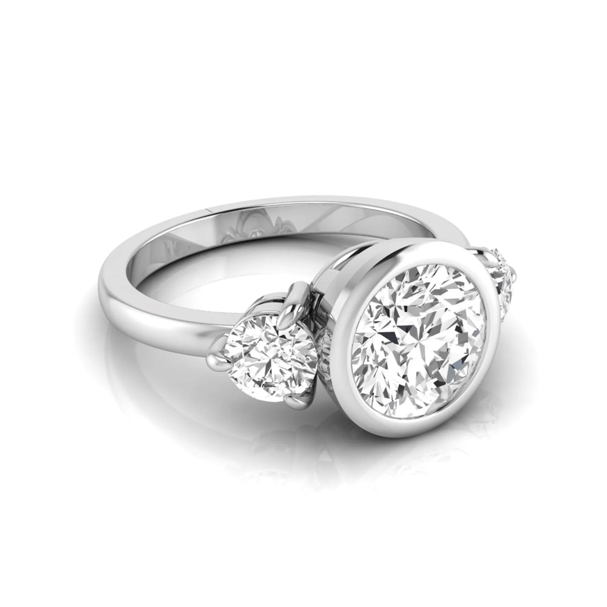 Round cut lab grown diamond three stone engagement ring with a bezel set center diamond and round side diamonds in white gold